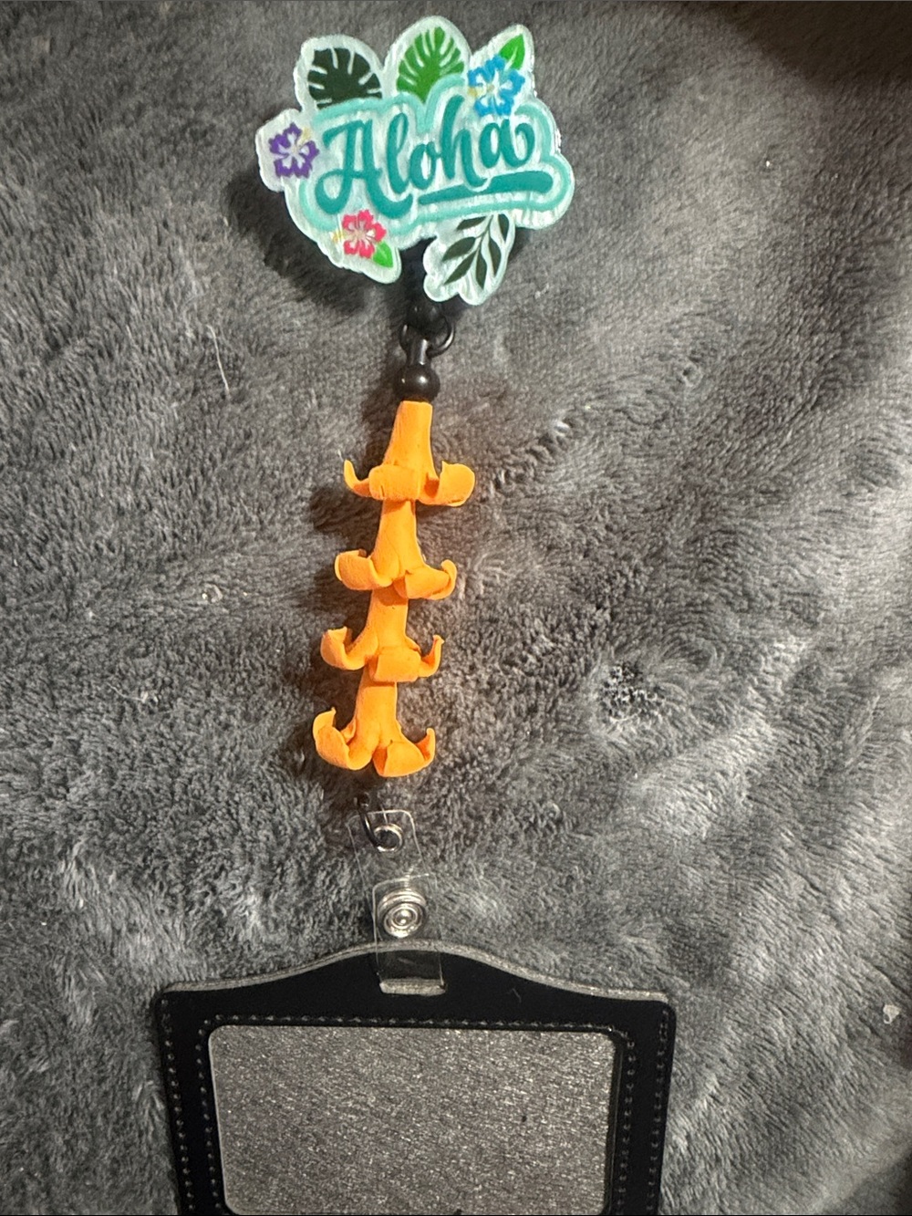 Aloha Badge Reel with Orange Puakenikeni Flowers with ID Holder
